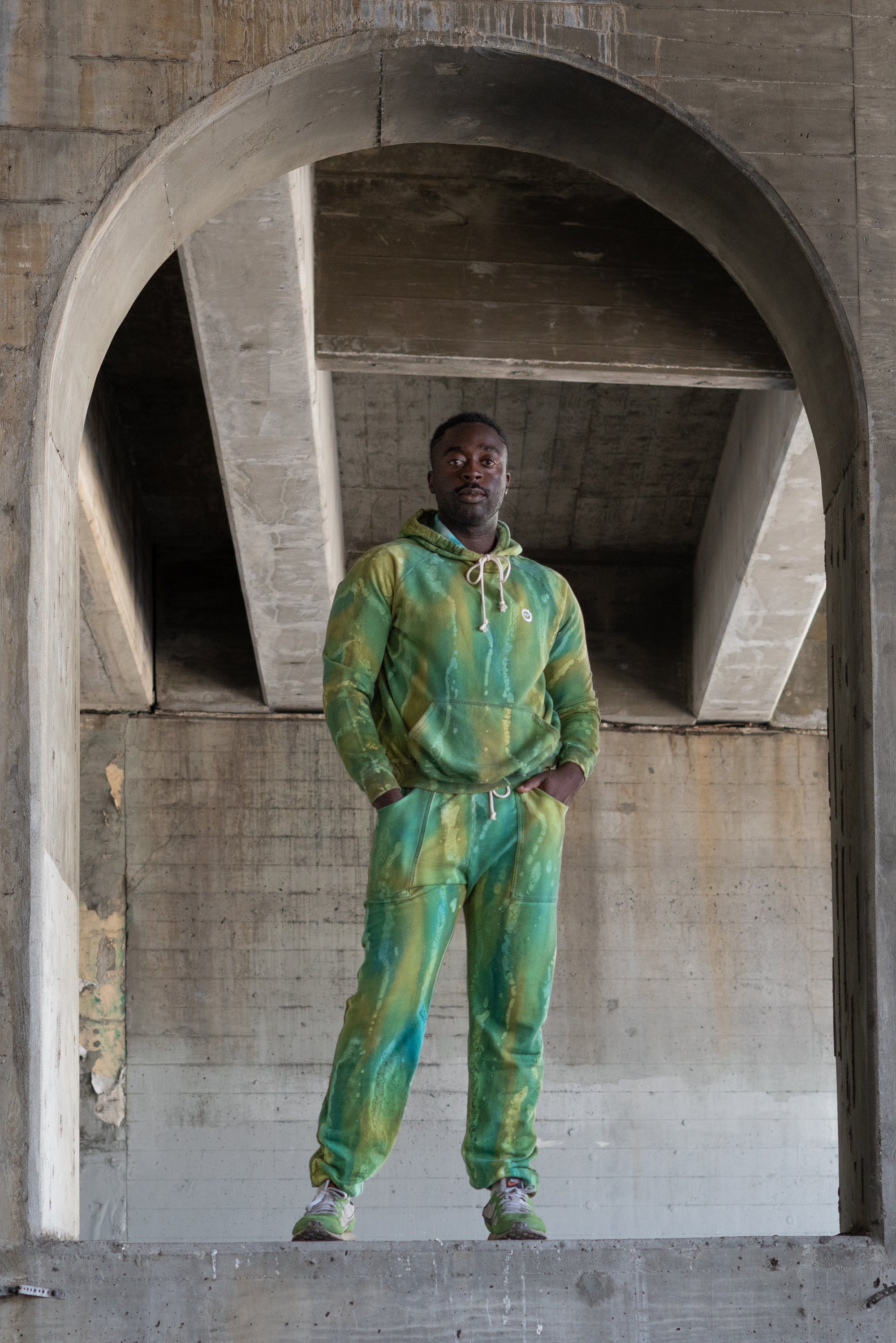 Eli wearing Hand Painted Sweats in Green Moss