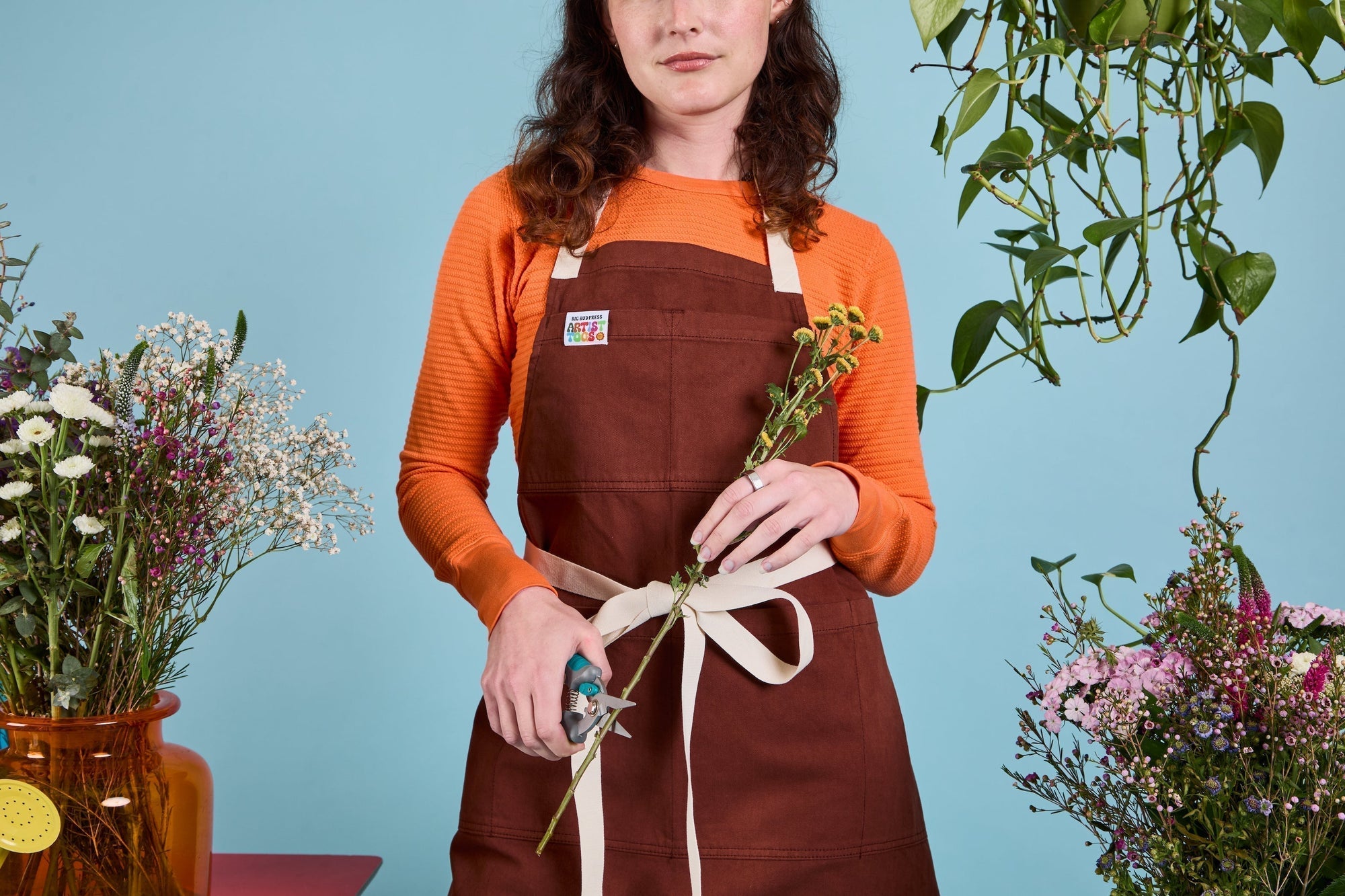 Alex is wearing a fudgesicle apron