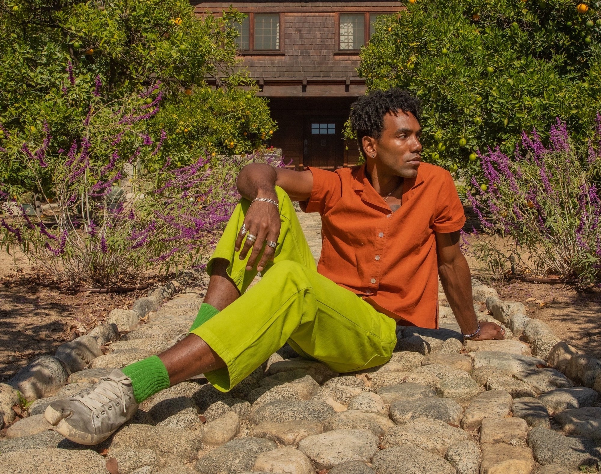 Jerrod wearing Pantry Button-Up in Burnt Orange, Work Pants in Gross Green, Thick Crew Socks in Kelly Green