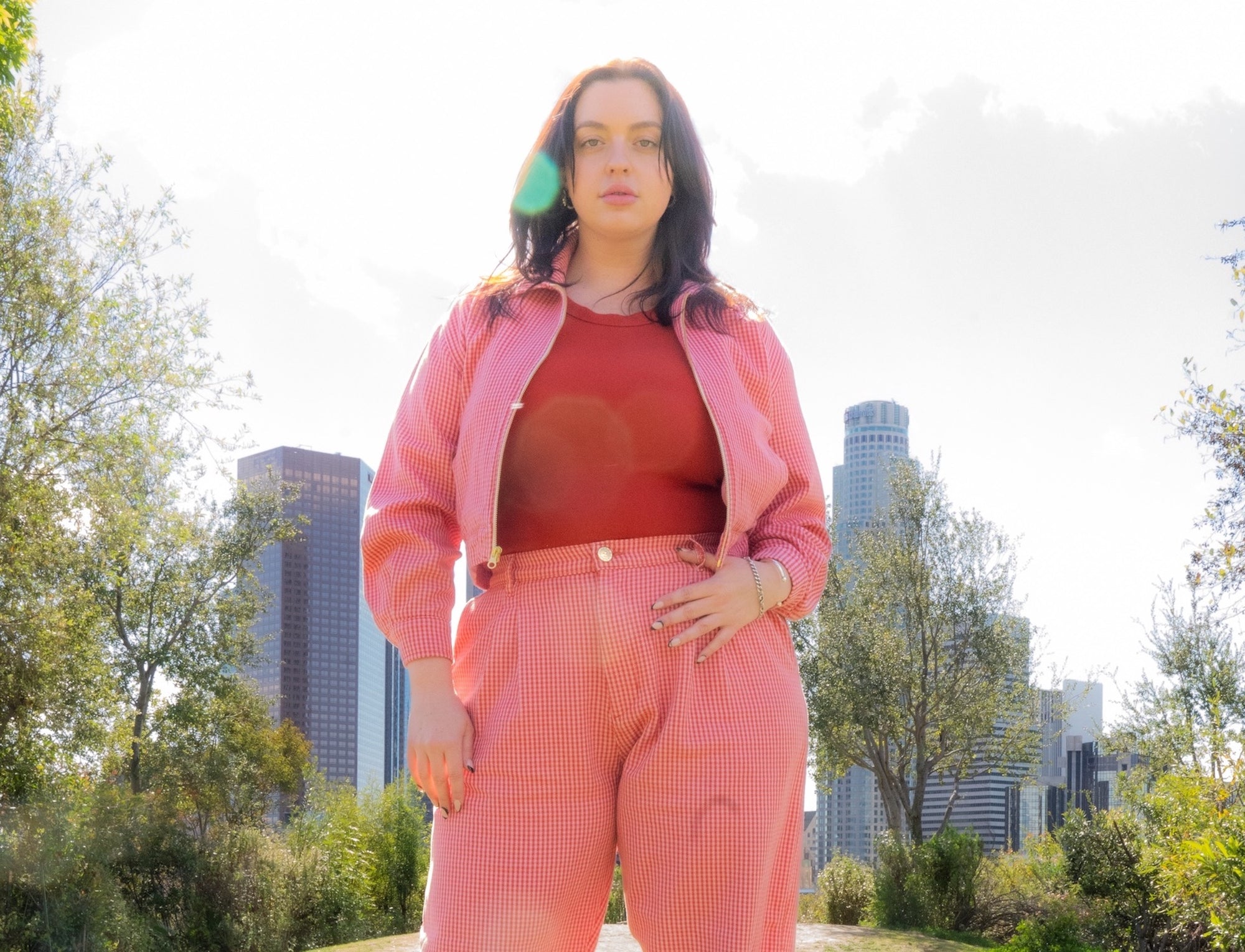 Faye wearing Ricky Jacket and Trousers in Pink Checkers paired with Baby Tee in Paprika