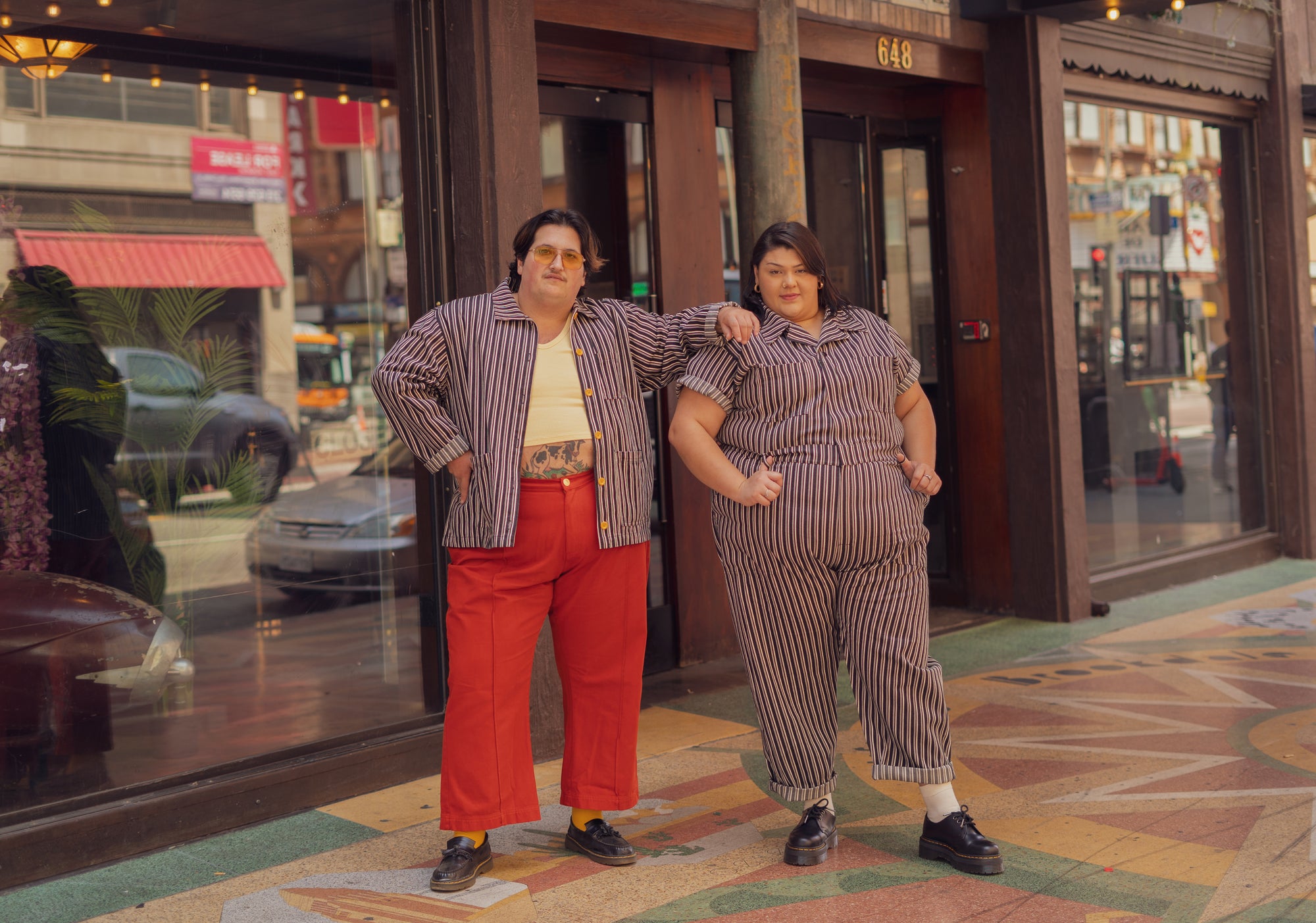 Black Frontier Short Sleeve Jumpsuit and Work Jacket on Sarita and Sam