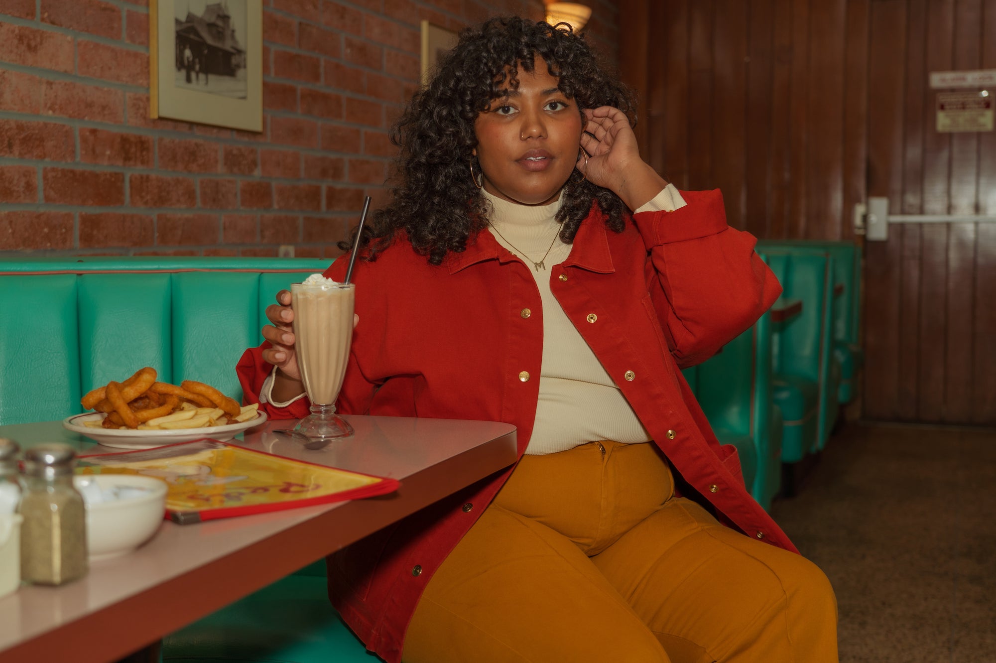 Morgan is wearing Denim Work Jacket in Paprika, Essential Turtleneck in Vintage Off-White and Western Pants in Spicy Mustard
