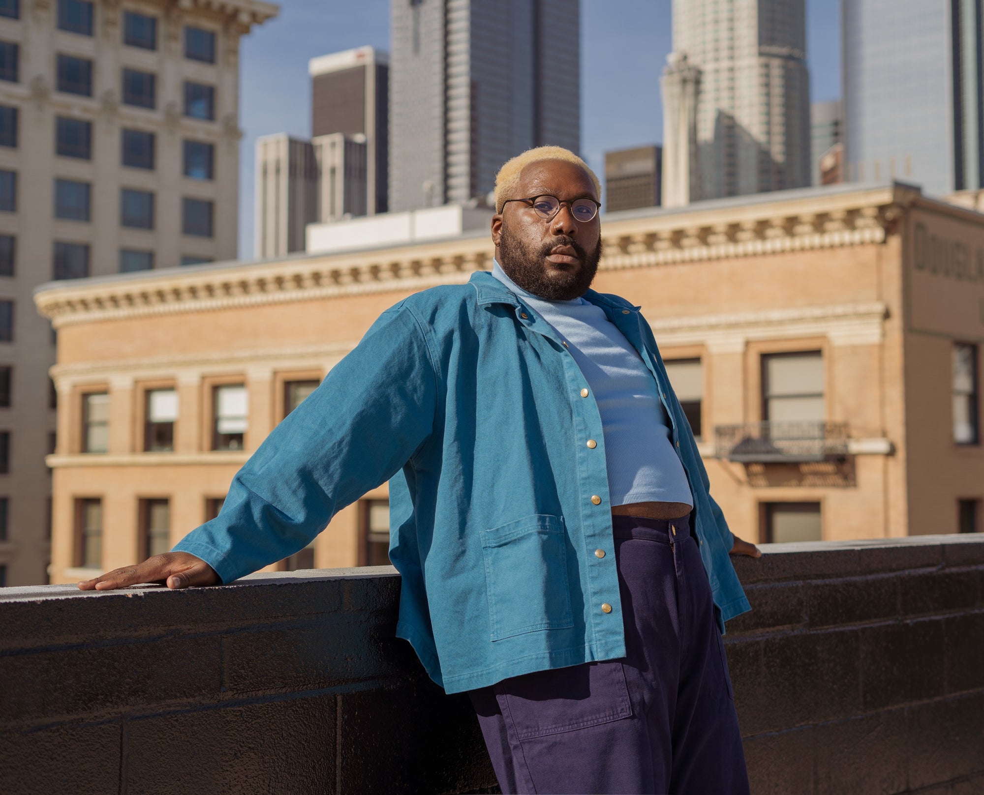 Elijah wearing Work Jacket in Marine Blue, 1/2 Sleeve Essential Turtleneck in Baby Blue, and Work Pants in Navy Blue