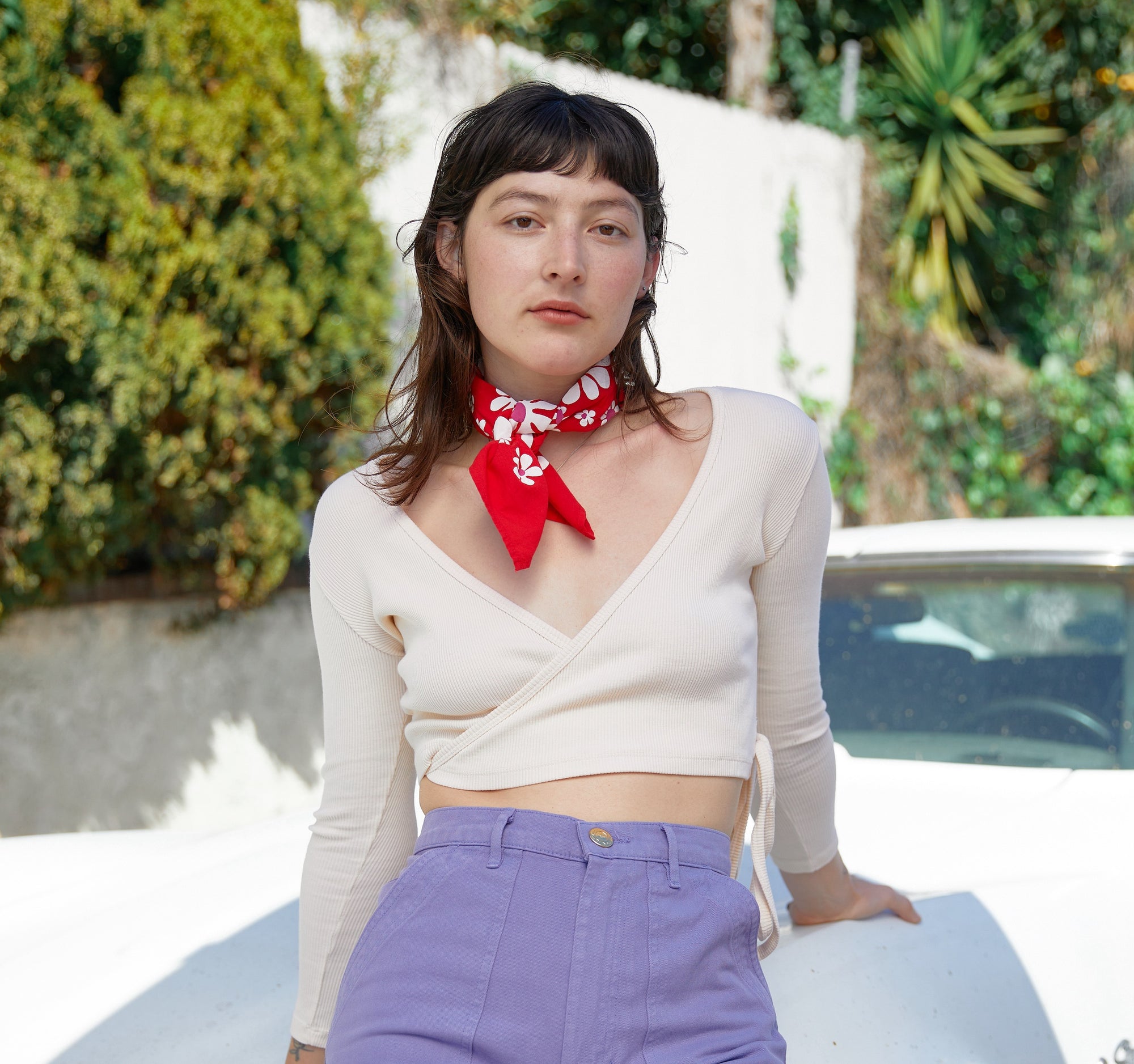 Alexandra Skye wearing Wrap Top in Vintage Off-White, Work Shorts in Faded Grape and Lazy Daisy Bandana in Mustang Red