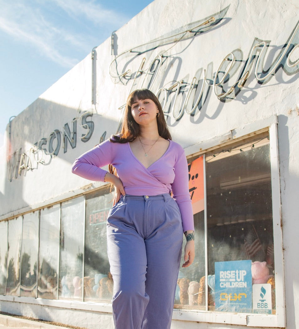 Sydney wearing Wrap Top in Lilac Purple and Trousers in Faded Grape