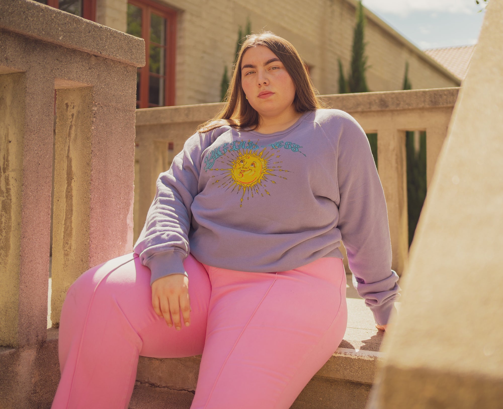 Marielena is wearing Bill Ogden's Sun Baby Crew in Faded Grape and Western Pants in Bubblegum Pink