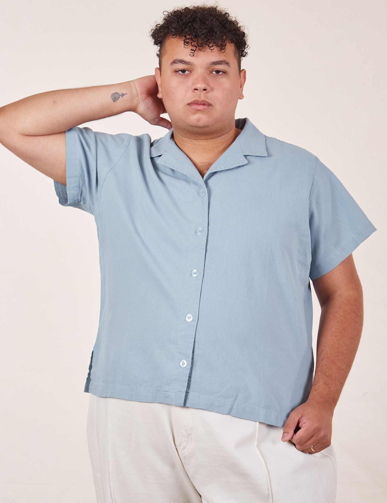 Miguel is wearing Pantry Button-Up in Periwinkle