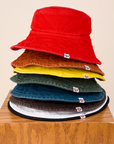 A stack of Wide Brim Denim Bucket Hats