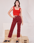 Alex is 5'8" and wearing XXS Railroad Carpenter Jeans in Mustang Red paired with mustang red Square Neck Tank