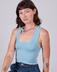 Alex is 5'8" and wearing P Cropped Tank Top in Baby Blue