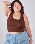 Ashley is 5'7" and wearing L Cropped Tank Top in Fudgesicle Brown