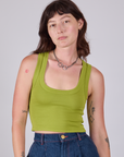 Alex is 5'8" and wearing P Cropped Tank Top in Gross Green