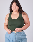Ashley is 5'7" and wearing L Cropped Tank Top in Swamp Green