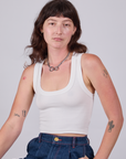 Alex is 5'8" and wearing P Cropped Tank Top in Vintage Tee White
