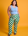 Ashley is 5'7" and wearing 1XL Checkerboard Work Pants in White/Green paired with baby blue Tank Top