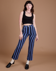 Alex is 5’8” and wearing XXS Black Stripe Work Pants in Cornflower Blue paired with black Cropped Tank