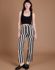 Alex is 5’8” and wearing XXS Black Stripe Work Pants in White