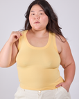 Ashley is 5'7" and wearing L Tank Top in Butter Yellow