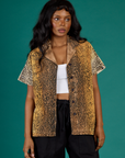Kandia is 5'3" and wearing XXS Leopard Pantry Button Up