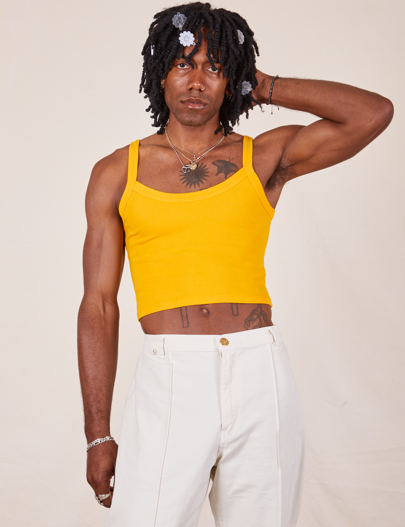 Jerrod is 6&#39;3&quot; and wearing S Cropped Cami in Sunshine Yellow paired with vintage tee off-white Western Pants