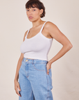 Tiara is 5'4" and wearing XS Cropped Cami in Vintage Tee Off-White paired with light wash Sailor Jeans