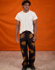 Isaac is 5'10" and wearing M Paintstamped Work Pants in Explosion paired with Organic Vintage Tee in Vintage Off-White