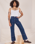 Jesse is 5'8" and wearing XS Carpenter Jeans in Dark Wash paired with Cropped Cami in vintage tee off-white