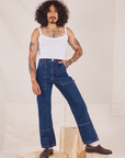 Jesse is 5'8" and wearing XS Carpenter Jeans in Dark Wash paired with a vintage off-white Cami