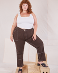 Bree is 5'9" and wearing 2XL Railroad Carpenter Jeans in Fudgesicle Brown paired with vintage tee off-white Square Neck Tank