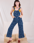 Alex is 5'8" and wearing XXS Carpenter Overalls in Lazy Daisy