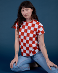 Alex is 5'8" and wearing P Checker Organic Tee in Red