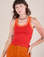 Alex is 5'8" and wearing P Colorblock Cropped Tank in Mustang Red