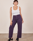 Tiara is 5'4" and wearing S Work Pants in Nebula Purple paired with Cropped Tank Top in vintage tee off-white