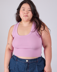 Ashley is 5'7" and wearing L Cropped Tank Top in Lilac