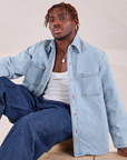 Issac is wearing Denim Overshirt in Light Wash