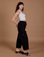 Side view of Drop Pocket Cargo Pants in Basic Black worn by Alex