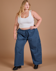 Juliet is 5’7” and wearing 1XL Drop Pocket Cargo Pants in French Blue paired with a Cropped Tank in Vintage Tee White