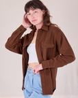 Alex is 5'8" and wearing P Flannel Overshirt in Fudgesicle Brown