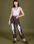 Alex is 5'8" and wearing XS Guy Colwell Work Pants in Woman & Man paired with a Cropped Tank in Vintage Tee Off-White