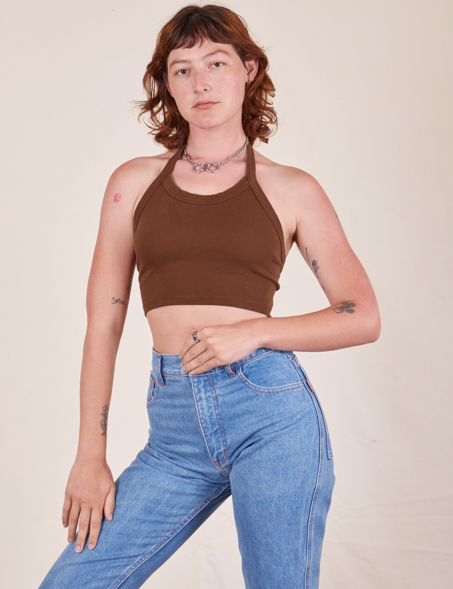 Alex is 5&#39;8&quot; and wearing P Halter Top in Fudgesicle Brown worn with light wash Frontier Jeans
