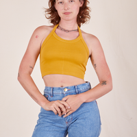 Alex is 5'8" and wearing P Halter Top in Mustard Yellow
