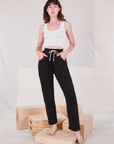 Alex is 5'8" and wearing P Rolled Cuff Sweat Pants in Basic Black paired with Cropped Tank in  vintage tee off-white 
