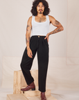 Jesse is 5'8" and wearing XXS Heavyweight Trousers in Basic Black paired with Cropped Tank Top in vintage tee off-white
