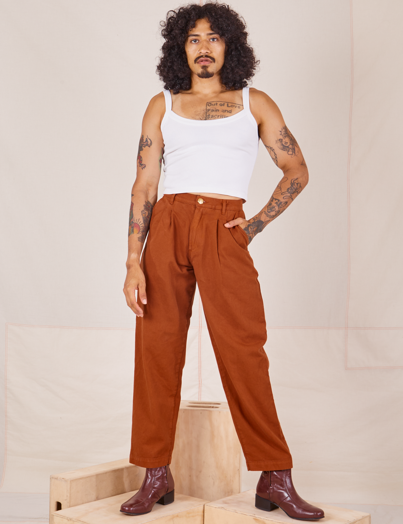 Jesse is 5'8" and wearing XXS Heavyweight Trousers in Burnt Terracotta paired with Cropped Cami in vintage tee off-white 