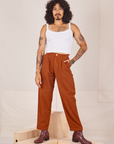 Jesse is 5'8" and wearing XXS Heavyweight Trousers in Burnt Terracotta paired with Cropped Cami in vintage tee off-white