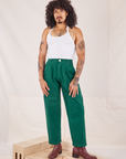 Jesse is 5'8" and wearing XXS Heavyweight Trousers in Hunter Green paired with Halter Top in vintage tee off-white