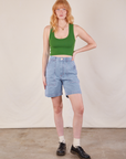 Margaret is 5'11" and wearing XS Carpenter Shorts in Light Wash paired with a lawn green Cropped Tank