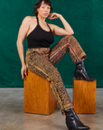 Tiara is wearing Leopard Work Pants paired with black Halter Top