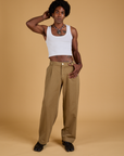 Jerrod is 6'3" and wearing M Baggy Mid-Rise Trousers in Desert Brown