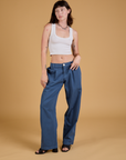 Alex is 5'8" and wearing XXS Baggy Mid-Rise Trousers in French Blue paired with a vintage tee white Cropped Tank